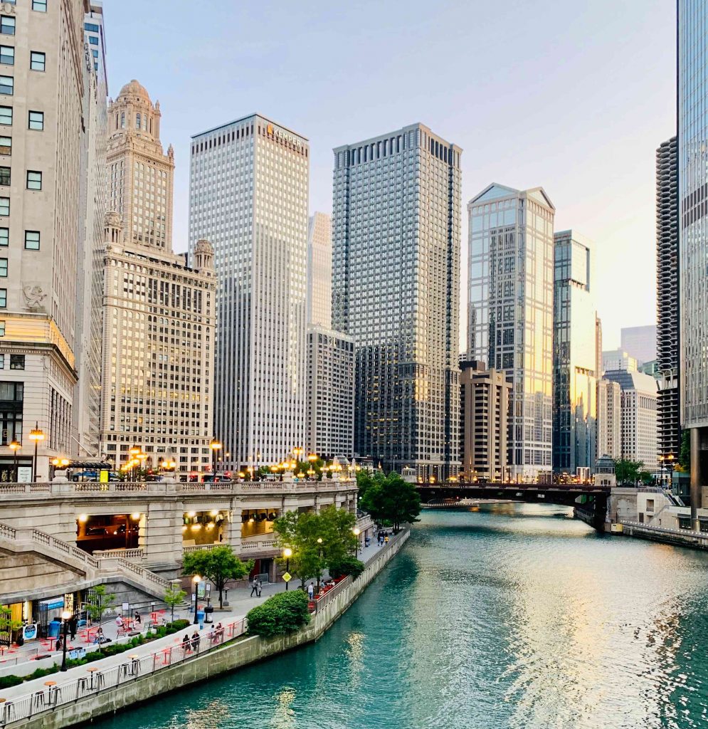 downtown chicago taken from bridge over chicago river. tall office buildings and the river in view